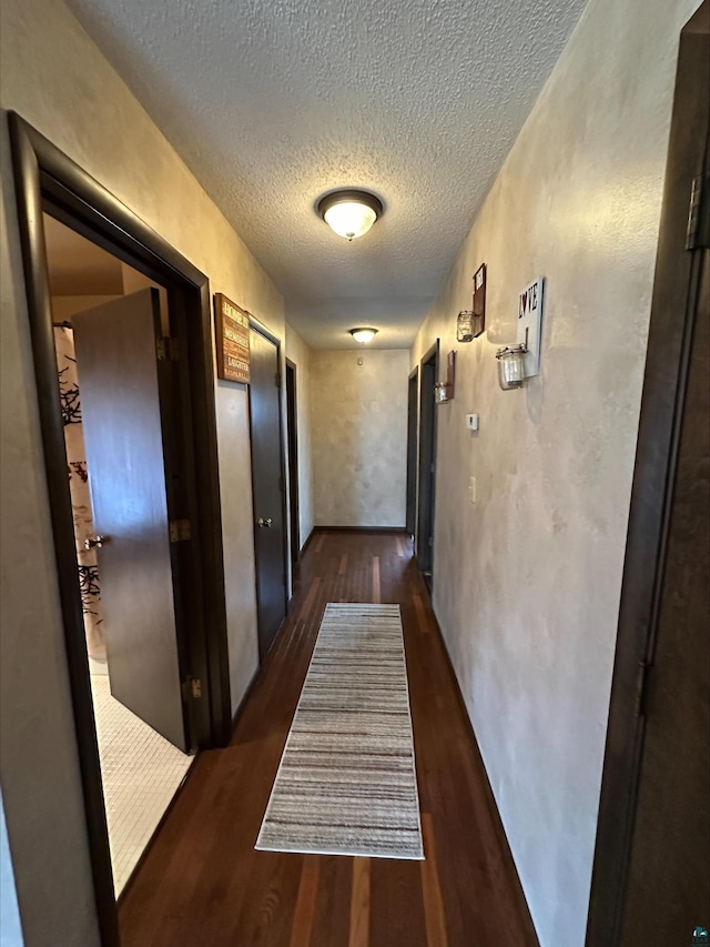3824 Rehbein Rd, Duluth, MN 55803 - corridor with dark wood finished floors and a textured ceiling