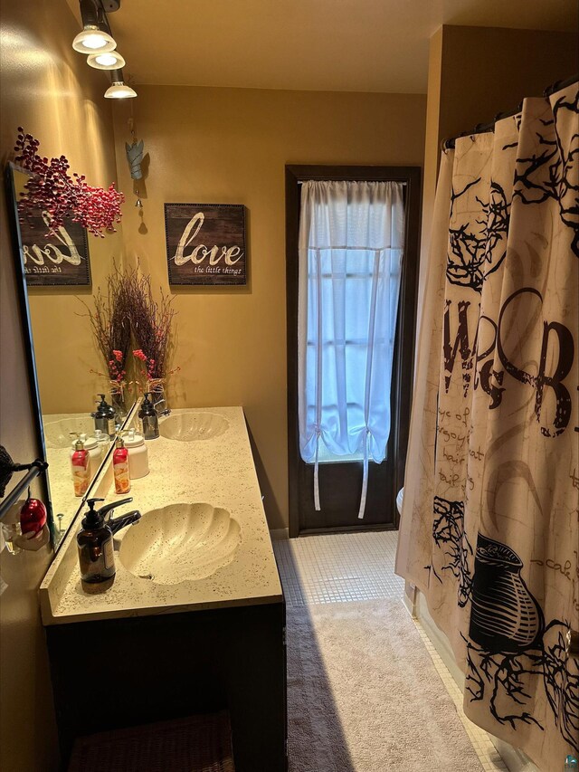 3824 Rehbein Rd, Duluth, MN 55803 - full bathroom with a sink, double vanity, and a shower with shower curtain