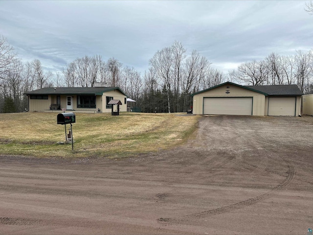 3824 Rehbein Rd, Duluth, MN 55803 - ranch-style house with a detached garage, an outbuilding, and a front yard