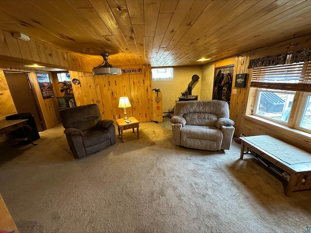 3824 Rehbein Rd, Duluth, MN 55803 - carpeted living area with wooden walls, wooden ceiling, and a wood stove