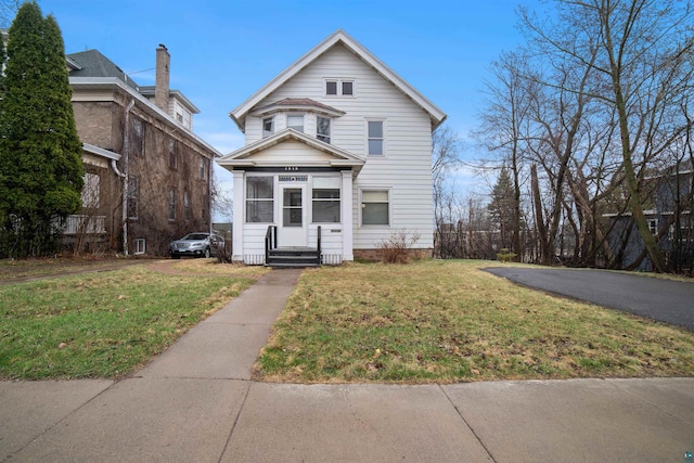 traditional home with a front lawn