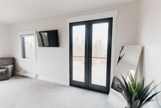 entryway featuring baseboards, plenty of natural light, french doors, and carpet