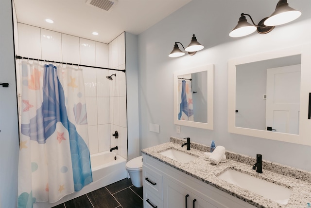 full bath featuring double vanity, visible vents, shower / bath combination with curtain, and a sink