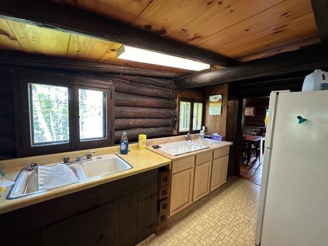 kitchen featuring light countertops, rustic walls, white appliances, and wooden ceiling