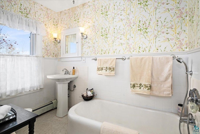 full bath with a washtub, wallpapered walls, a wainscoted wall, and a baseboard radiator