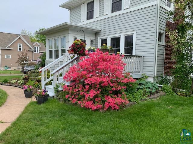 view of home's exterior with a yard