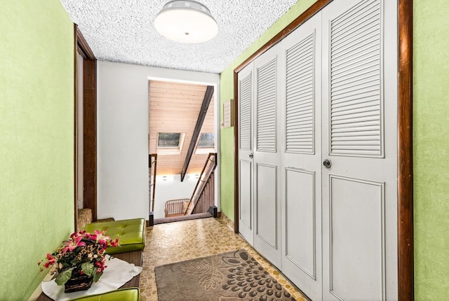 hallway with tile patterned floors
