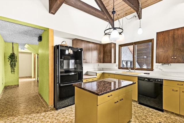 kitchen with beam ceiling, a center island, a sink, dark stone countertops, and black appliances