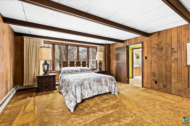 carpeted bedroom with a baseboard heating unit, beam ceiling, and wooden walls