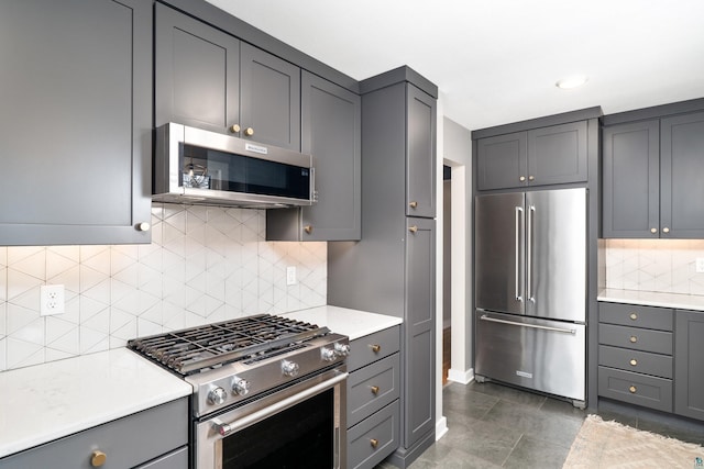 kitchen featuring light countertops, gray cabinets, and stainless steel appliances