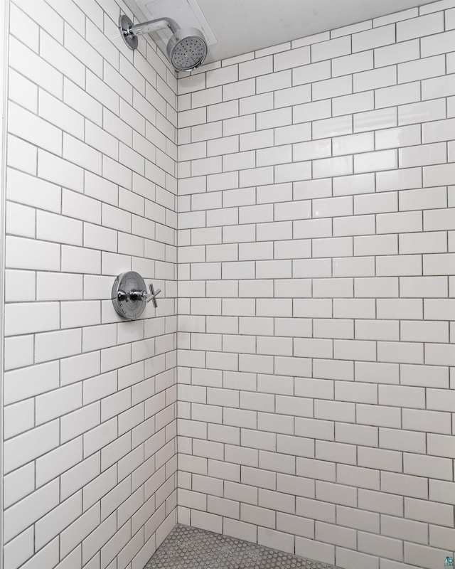 bathroom with tiled shower