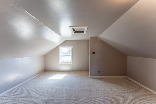 25 4th Ave, Soudan, MN 55782 - additional living space with carpet floors, attic access, baseboards, and vaulted ceiling