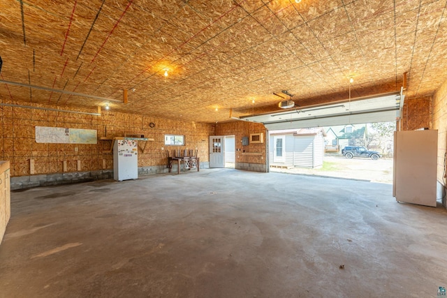 25 4th Ave, Soudan, MN 55782 - garage featuring a garage door opener