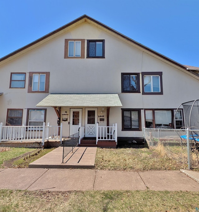 1441 90th Ave W, Duluth, MN 55808 - multi unit property with a porch, stucco siding, and fence