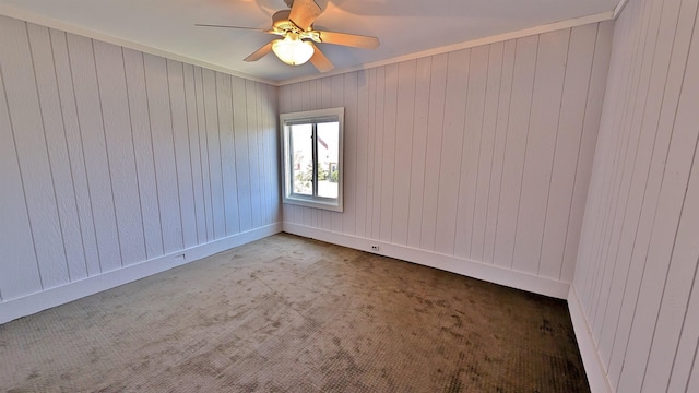 1441 90th Ave W, Duluth, MN 55808 - carpeted spare room with baseboards, a ceiling fan, and wood walls