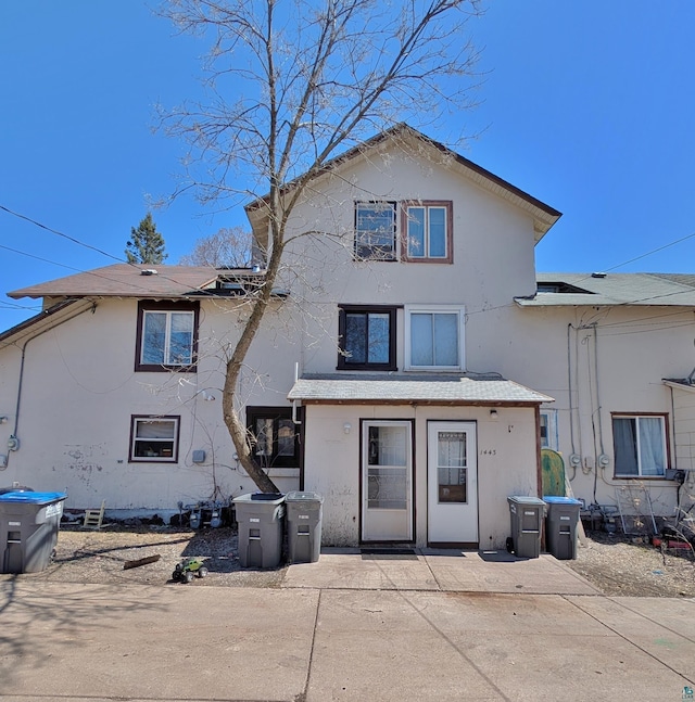 1441 90th Ave W, Duluth, MN 55808 - back of house with a patio and stucco siding