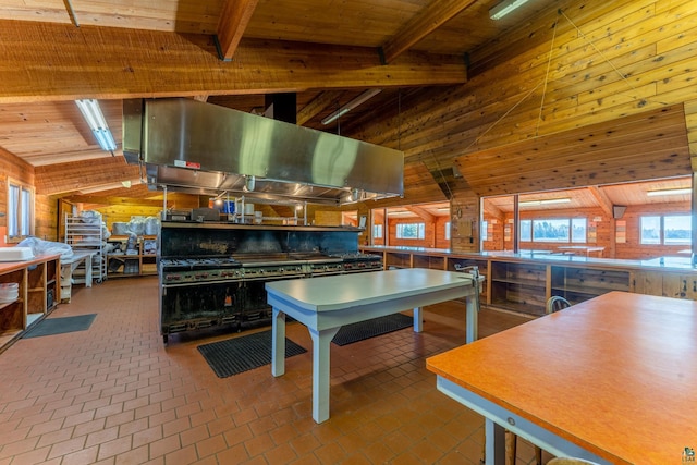 rec room featuring wooden walls, wood ceiling, and lofted ceiling with beams