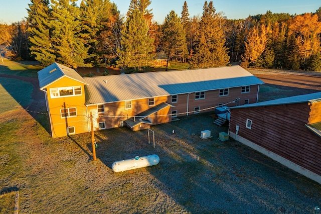 drone / aerial view featuring a view of trees