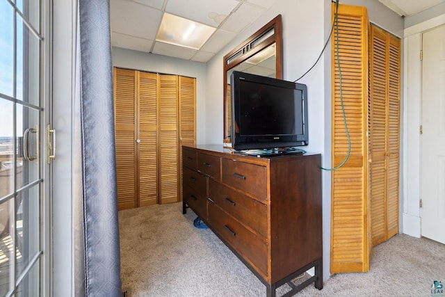 bedroom featuring light colored carpet
