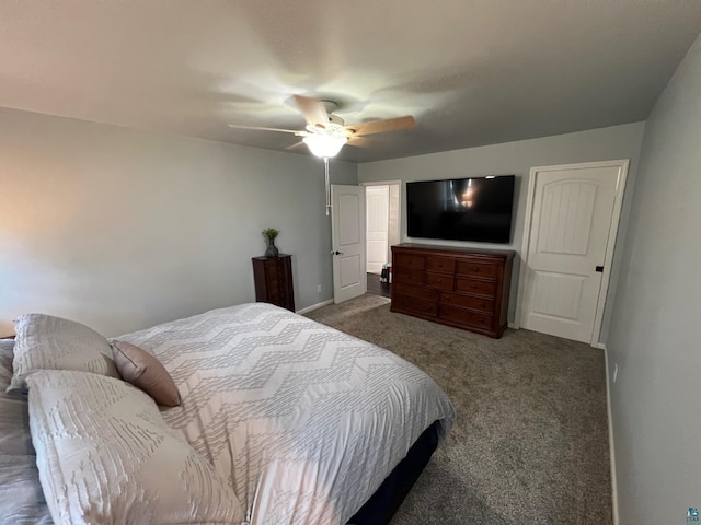 bedroom with baseboards, ceiling fan, and carpet