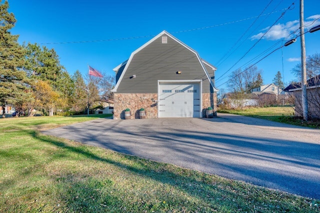 detached garage featuring driveway