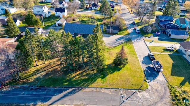 birds eye view of property with a residential view