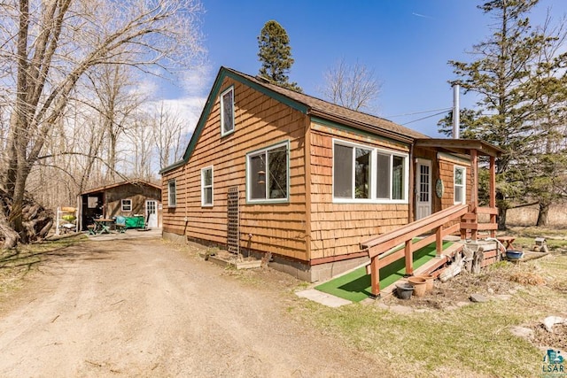 view of home's exterior featuring driveway