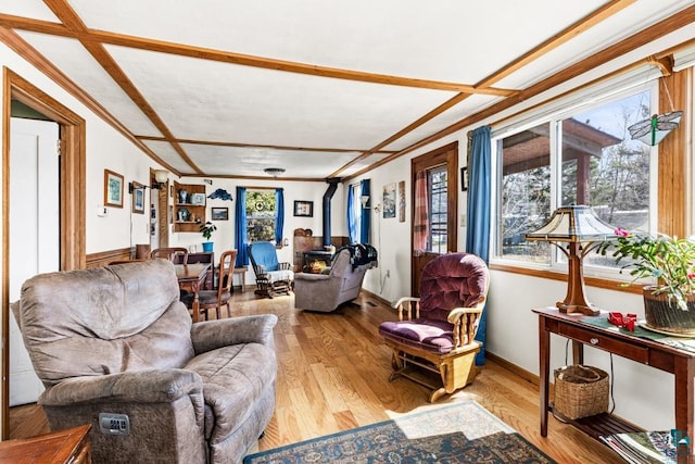 living room with plenty of natural light and wood finished floors