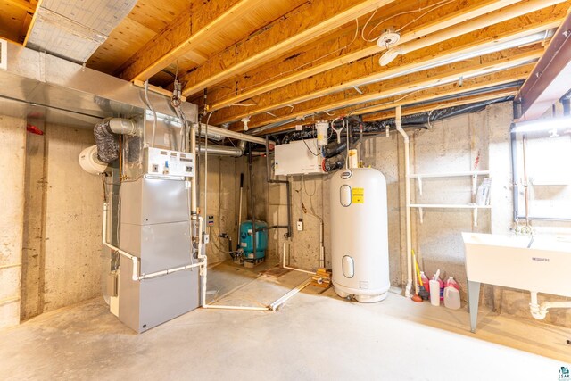 unfinished basement with heating unit, a sink, and water heater