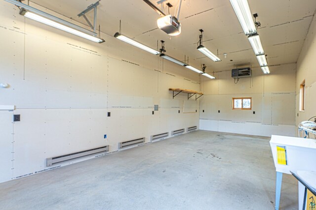garage featuring a baseboard radiator and a garage door opener