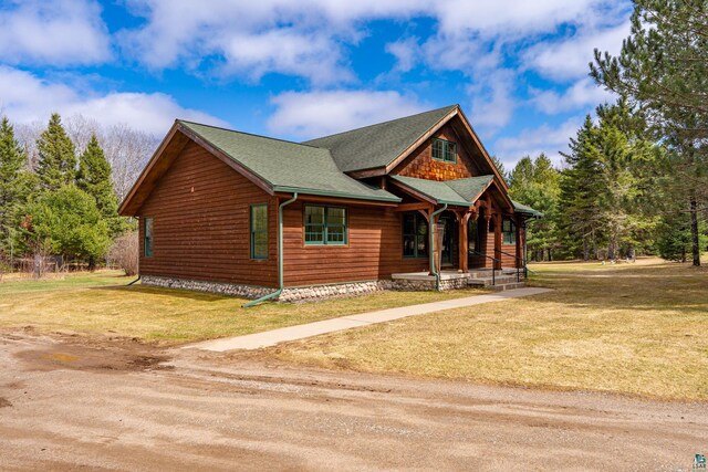 view of front of house featuring a porch and a front lawn