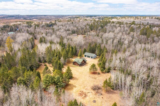 birds eye view of property with a view of trees