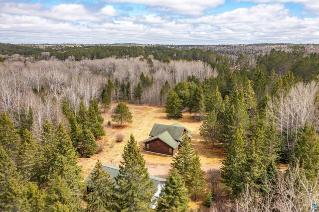 birds eye view of property featuring a wooded view