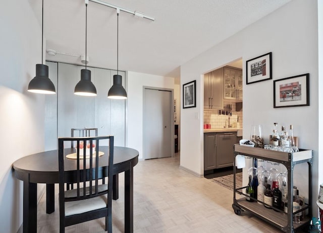 410 Groveland Ave Unit 1203, Minneapolis, MN 55403 - dining area featuring track lighting and a dry bar
