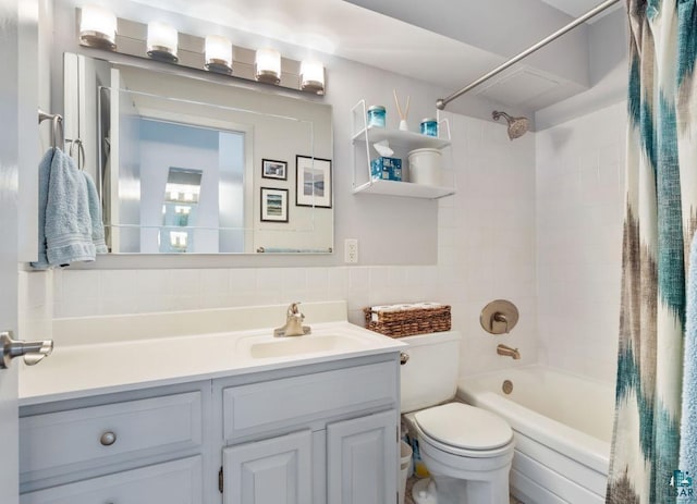 410 Groveland Ave Unit 1203, Minneapolis, MN 55403 - bathroom featuring vanity, shower / bath combination with curtain, toilet, and tile walls