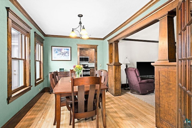 dining room featuring an inviting chandelier, baseboards, ornamental molding, and light wood-style flooring