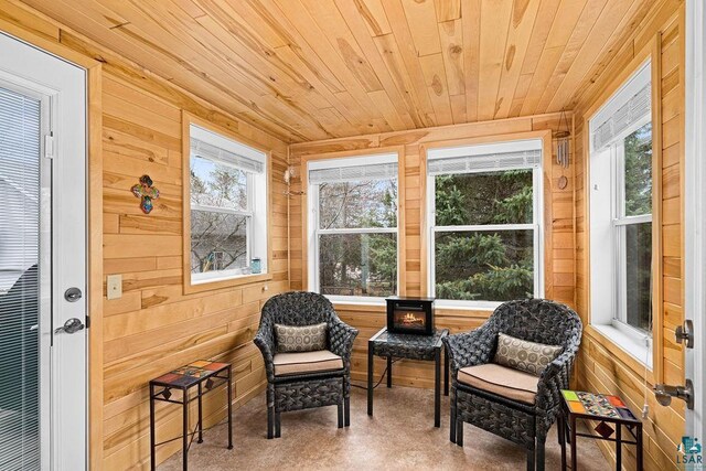 sunroom / solarium with wood walls and wood ceiling