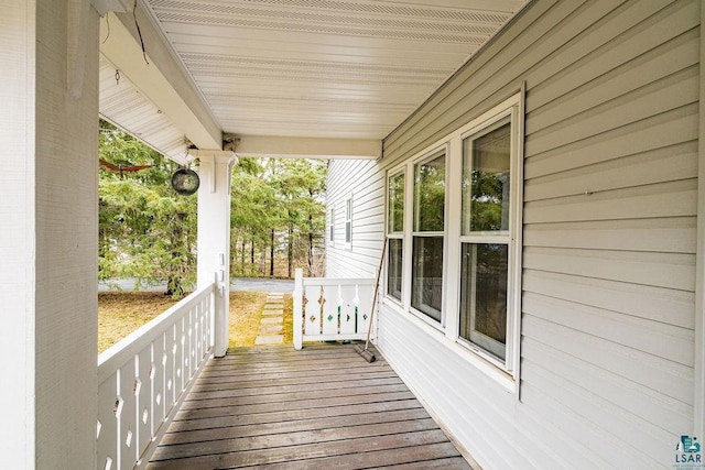 wooden deck featuring covered porch