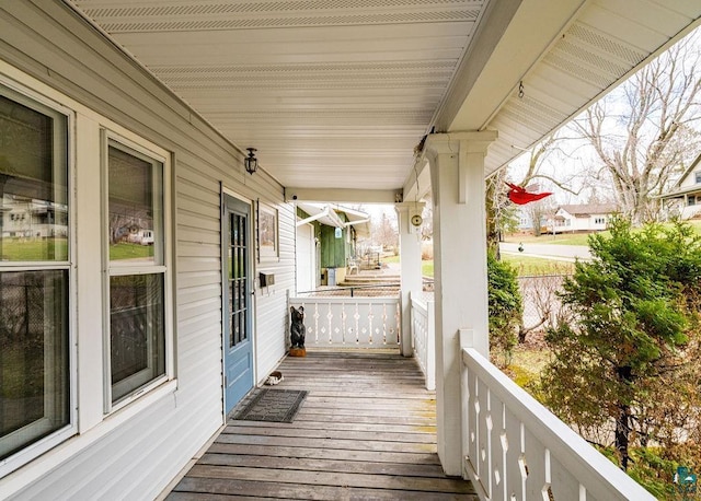 wooden terrace featuring a porch