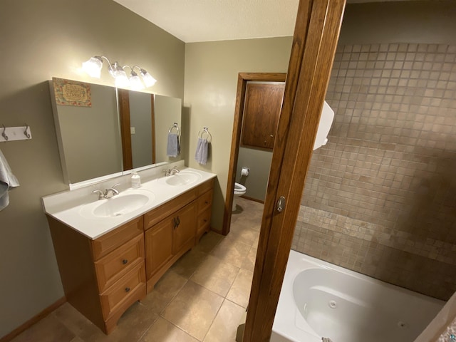 full bathroom with toilet, a tub with jets, a sink, and tile patterned flooring