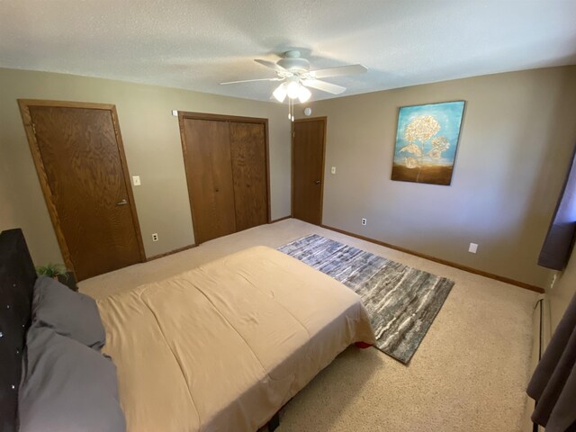 carpeted bedroom featuring a ceiling fan and a closet