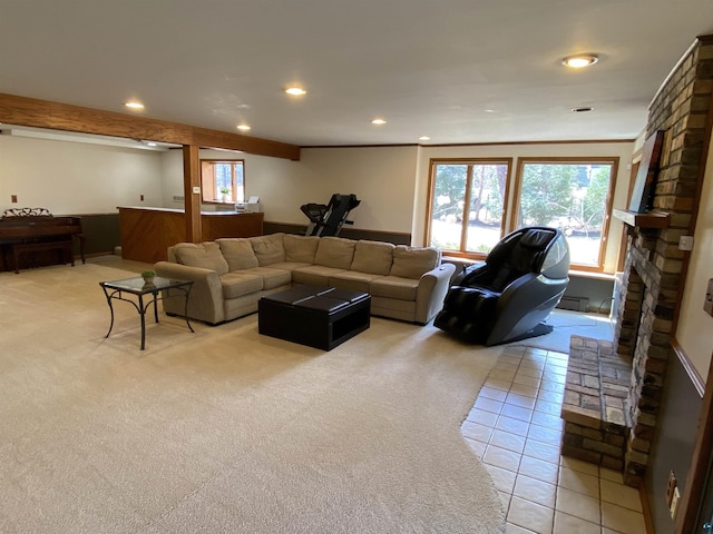living room with recessed lighting, a large fireplace, light tile patterned floors, and light carpet
