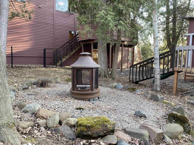 view of yard with stairs and a wooden deck