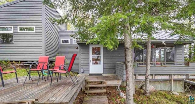 rear view of house with a wooden deck