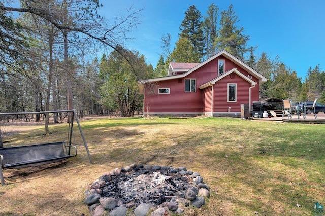 view of property exterior featuring a lawn