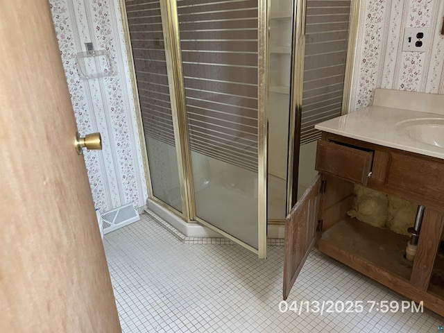 full bath featuring tile patterned flooring, a stall shower, wallpapered walls, and visible vents
