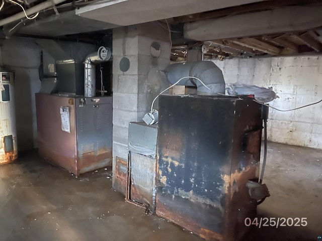 utility room featuring heating unit and water heater