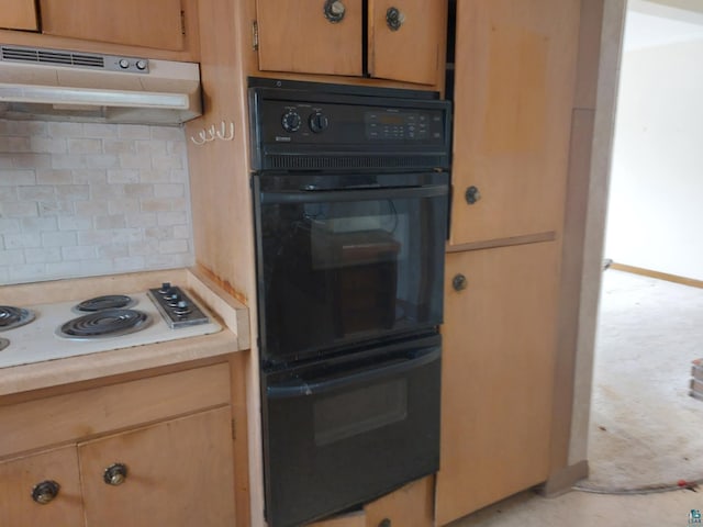 kitchen featuring light countertops, dobule oven black, white electric cooktop, decorative backsplash, and under cabinet range hood