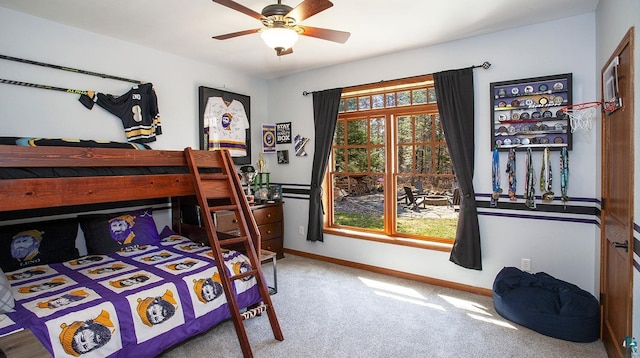 carpeted bedroom featuring baseboards and a ceiling fan