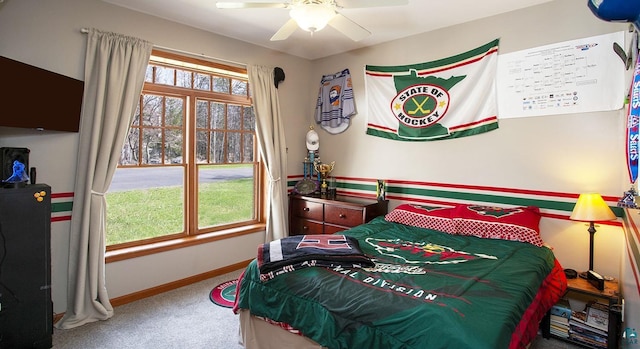 bedroom featuring carpet flooring, a ceiling fan, and baseboards